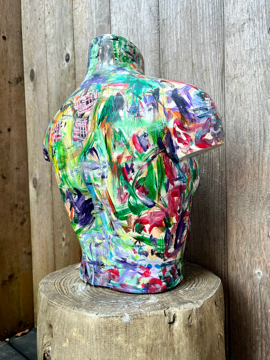Artistic wooden bust sculpture of a female form with energetic multicolor paintwork, created by Cindy Trestman.